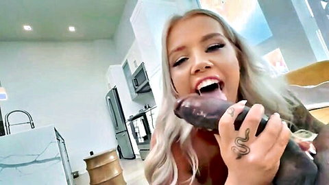 Blonde babe with snake tattoo grins deepthroating thick purple dildo in kitchen