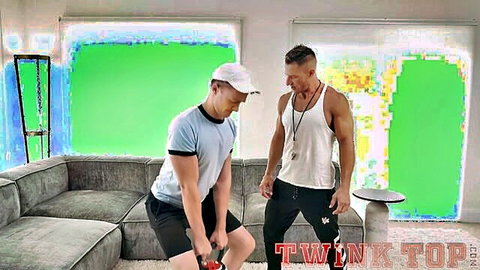 Muscular personal trainer with big dick poses with twink during intense gym workout session