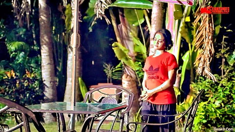 Indian MILF in red Adidas tee and black pants teasing outdoors with huge ass