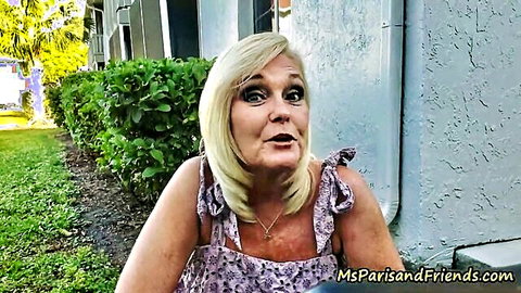Blonde MILF in purple off-shoulder top with surprised expression