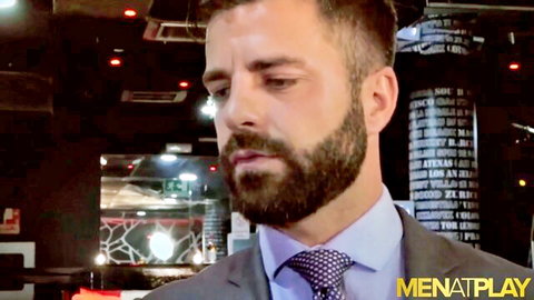 Bearded businessman in suit looking intense, ready for rimming punishment