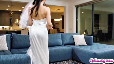 Annie Charlotte in tight white wedding dress, teasing curves from behind