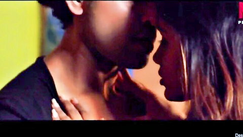 Young Indian couple in passionate close-up kiss, brunette beauty with long hair embracing lover