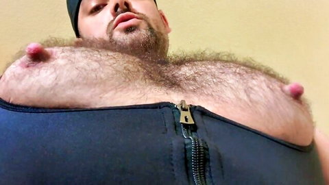 Hairy muscled DILF daddy teases big erect pink nipples in unzipped black harness