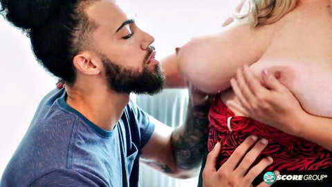 Blonde MILF Angel's massive tits kissed by stud in steamy scene