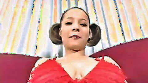 Young black woman in red dress with space buns and cleavage