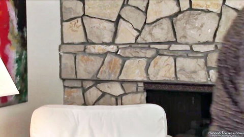Lisa Ann in taboo MILF scene, cozy sweater by fireplace