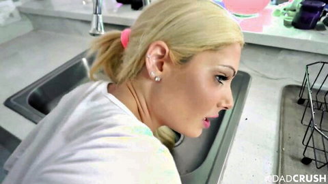 Blonde petite teen in white top leaning over kitchen sink, DadCrush preview