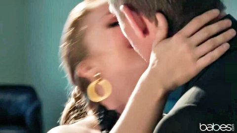 Lena Paul passionately kissing Mick Blue in intimate embrace
