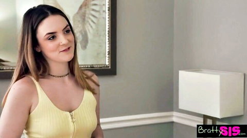Brunette step-sister in yellow zip-up tank top smiling seductively