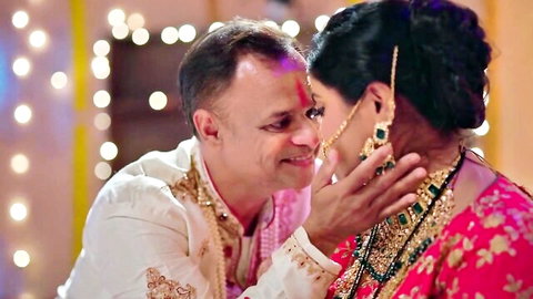 Indian MILF in pink saree nuzzling noses intimately with mature man in white kurta