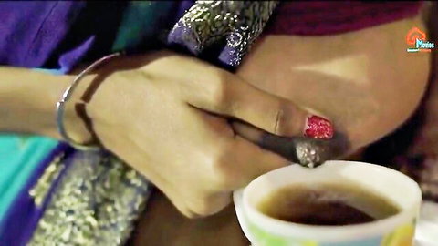 Sexy Indian woman exposes her bare tit and nipple while sipping tea from white cup in saree