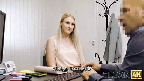 Blonde MILF waitress in pink top at desk with agent for steamy loan sex audition