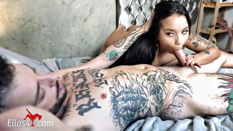 Safyra Safi with big tits and ass giving blowjob to tattooed man