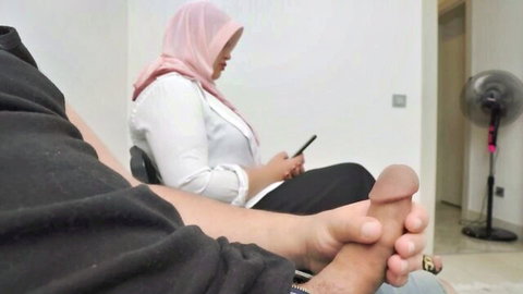 Muslim woman in pink hijab caught cheating, exposed cock nearby