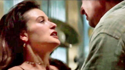 Brunette woman gazing up passionately at man in intimate close-up moment