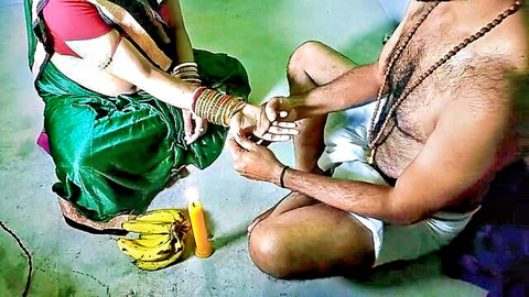 Indian tantrik baba in ritual worship with female devotee, suggestive encounter