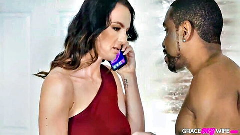 Madison Lust in red dress on phone with muscular black man