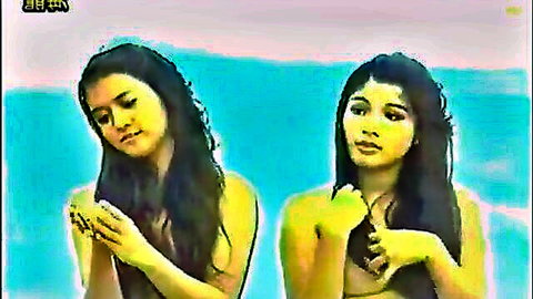 Two topless Filipina women posing seductively with hands over breasts, Dyesebel 1978