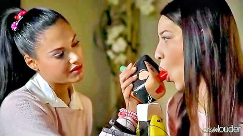 Two young novinhas in sweaters sharing intimate oral play with toy