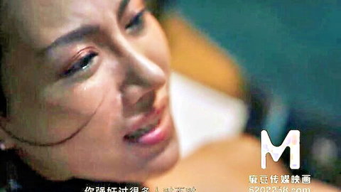 Young Asian policewoman with teary eyes and seductive lips close-up