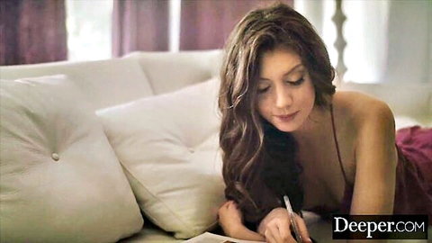 Elena Koshka in seductive purple lingerie, lying and writing playfully