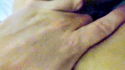 Blurry close-up of hand gripping pale skin in accidental creampie pregnancy scene