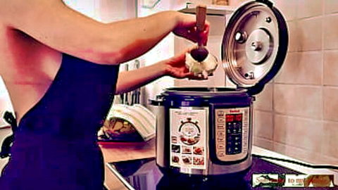 Thelma naked in apron cooking risotto, sideboob exposed