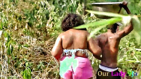SSBBW African village girl in pink shorts teases big ass in bush with watchman