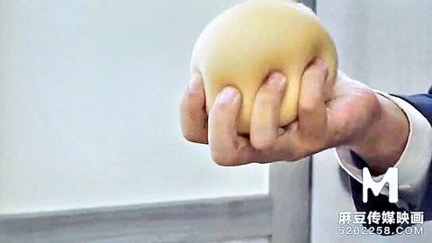 Wen Rui Xin squeezing yellow stress ball in suit sleeve teaser