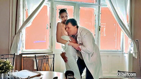 Teen bride topless, kissed and groped by older doctor in lab coat