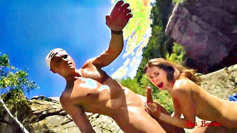 Skinny brunette teen babe sucking muscular guy's hard cock outdoors by river rocks