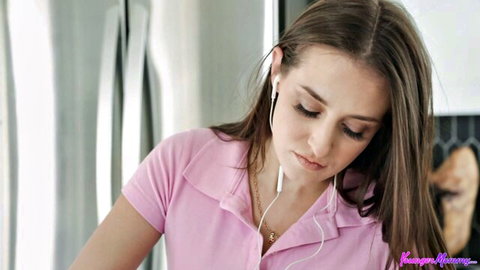 Aubree Valentine in pink top with earbuds, teasing POV preview