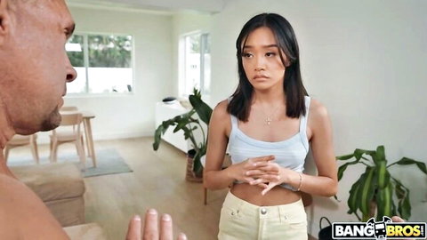 Jade Kimiko in white tank top and jeans teases Peter Fitzwell in BangBros scene