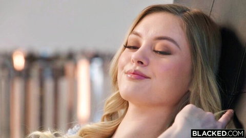Amber Moore blonde beauty eyes closed smiling in seductive Blacked pose