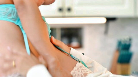 Hailey Rose in teal lace lingerie, hand on hip in steamy threesome tease