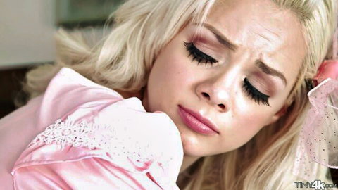 Elsa Jean in pink lingerie with surprised expression, sex doll tease