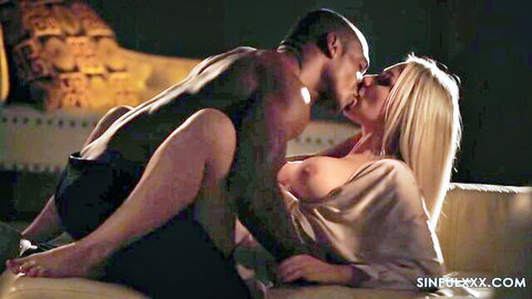 Angie Lynx topless kissing muscular Aaron Rock in passionate SinfulXXX interracial scene
