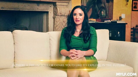 Sheena Ryder in sexy green dress, MILF interview pose