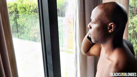 Muscular black man shirtless by window on phone, Blacks on Blondes scene with Tommy King