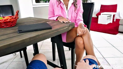 Tattooed MILF in pink blazer crosses legs teasing guy caressing her thigh in kitchen