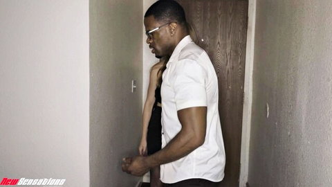 Muscular black man in glasses gropes curvy white woman's sideboob in tight hallway