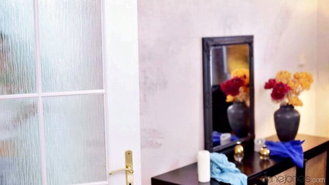 Blonde Dane Jones in bedroom with mirror, flowers; threesome tease with Molly DeVon