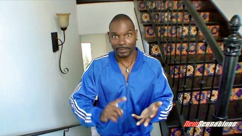 Black man in blue Adidas tracksuit posing in New Sensations adult video thumbnail