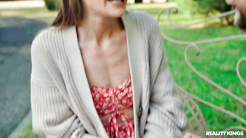 Tiffany Tatum in open cardigan over red floral top on sneaky outdoor date with Vince Karter