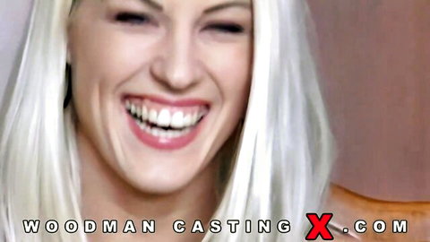 Blonde babe with glossy lips smiling widely in Woodman casting interview