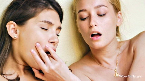 Ellie Luna and Kelly Collins nude, hand in mouth in hot lesbian tease