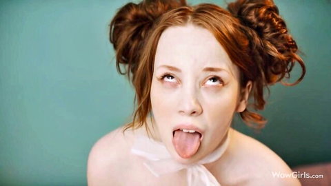 Lottie Magne redhead with pigtails sticks tongue out nude in collar