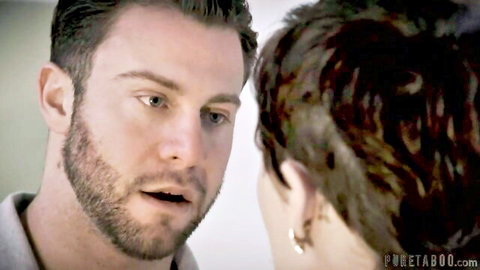 Olive Glass and Seth Gamble in intense close-up eye contact