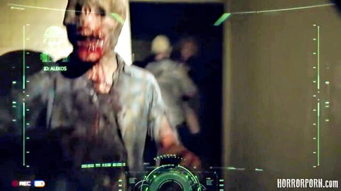 Bloody zombie in horror-themed group sex frenzy with green HUD overlay
